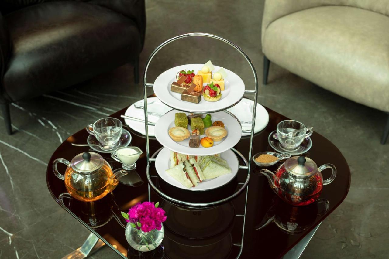 Radisson Blu Atria Bengaluru Bangalore Exterior foto Afternoon tea at the InterContinental Hotel, London